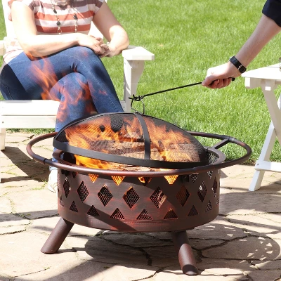 Sunnydaze Decor Sunnydaze Outdoor Camping Or Backyard Crossweave Cut Out Fire Pit With Spark Screen, Log Poker, And Metal Wood Grate - Bronze 7 Sunnydaze Decor Sunnydaze Outdoor Camping Or Backyard Crossweave Cut Out Fire Pit With Spark Screen, Log Poker, And Metal Wood Grate - Bronze - Image 5